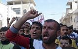 Anti-Assad protest in the village of Binnish, near Idlib in northern Syria, October 12 (photo credit: AP)
