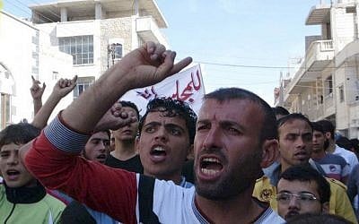 Anti-Assad protest in the village of Binnish, near Idlib in northern Syria, October 12 (photo credit: AP)