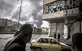 Smoke rises from the Karmal Jabl neighborhood during clashes between rebel fighters and the Syrian army in Aleppo, Syria, Thursday, October 25, 2012 (photo credit: AP/Narciso Contreras)