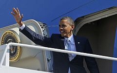 US President Barack Obama waves as he boards Air Force One en route to Las Vegas for a campaign rally on Sunday (photo credit: AP/Pablo Martinez Monsivais)