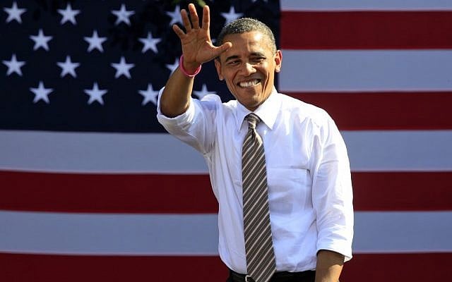 US President Barack Obama waves to supporters during a campaign rally in Byrd Park in Richmond, VA., Thursday, October 25, 2012. (photo credit: Steve Helber/AP)