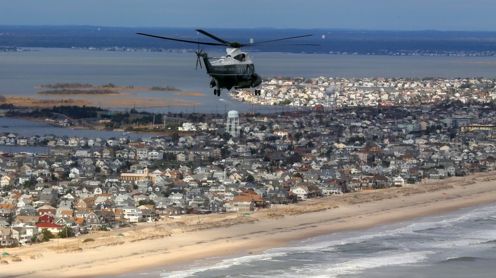 Marine One, carrying President Barack Obama and New Jersey Gov. Chris Christie, take an aerial tour of the Atlantic Coast in New Jersey in areas damaged by superstorm Sandy, Wednesday, Oct. 31, 2012 (photo credit:Doug Mills/ AP/ Pool)