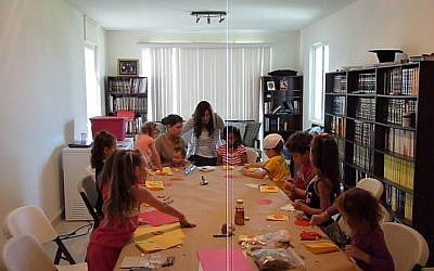 Rachel Druk (at the head of the table) gives a class at home for the local Jewish children (photo credit: courtesy of Chabad Cancun) Rachel Druk (at the head of the table) gives a class at home for the local Jewish children (photo credit: courtesy of Chabad Cancun)