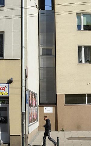 A passerby walks past one of the world’s narrowest houses, in Warsaw, Poland, Friday, Oct. 19, 2012 (photo credit: AP/Alik Keplicz) A passerby walks past one of the world’s narrowest houses, in Warsaw, Poland, Friday, Oct. 19, 2012 (photo credit: AP/Alik Keplicz)