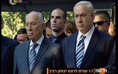 President Shimon Peres and Prime Minister Benjamin Netanyahu attend the memorial service for slain prime minister Yitzhak Rabin at Mt. Herzl cemetery in Jerusalem Sunday, Oct. 28, 2012. (screen capture: Channel 10)