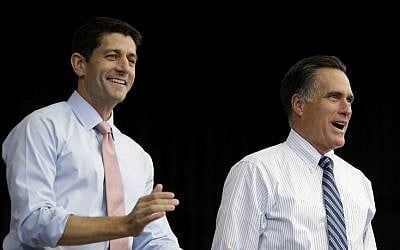 Republican presidential candidate, former Massachusetts Gov. Mitt Romney, right, and his vice presidential running mate, Rep. Paul Ryan, R-Wis., takes the stage at a campaign stop, Tuesday, Oct. 23, 2012, in Henderson, Nev. (photo credit: David Goldman/AP)