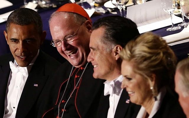 US President Barack Obama, left, sits with Cardinal Timothy Dolan, second left, and Republican presidential candidate Mitt Romney at the Alfred E. Smith Memorial Foundation Dinner in New York on Thursday (photo credit: AP/Charles Dharapak)