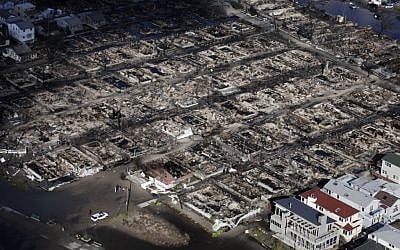 This aerial photo shows the Breezy Point neighborhood, in New York, Wednesday, Oct. 31, 2012, where more than 50 homes were burned to the ground Monday night as a result of superstorm Sandy. Sandy, the storm that made landfall Monday, caused multiple fatalities, halted mass transit and cut power to more than 6 million homes and businesses. (Mark Lennihan/AP)