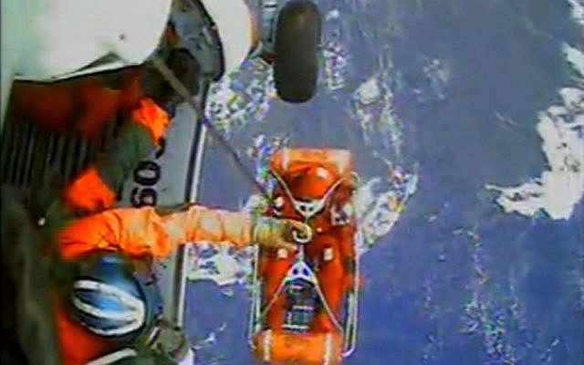 In this video image capture released by the US Coast Guard, a USCG crew member uses a hoist to bring up a survivor from the HMS Bounty into a helicopter. (photo credit: AP/U.S. Coast Guard) In this video image capture released by the US Coast Guard, a USCG crew member uses a hoist to bring up a survivor from the HMS Bounty into a helicopter. (photo credit: AP/U.S. Coast Guard)