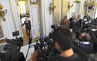 Peter Englund, permanent secretary of the Royal Swedish Academy, arrives to announce that Chinese writer Mo Yan has been named the winner of the 2012 Nobel Prize in literature on October 11 in Stockholm. (photo credit: AP/Fredrik Sandberg)