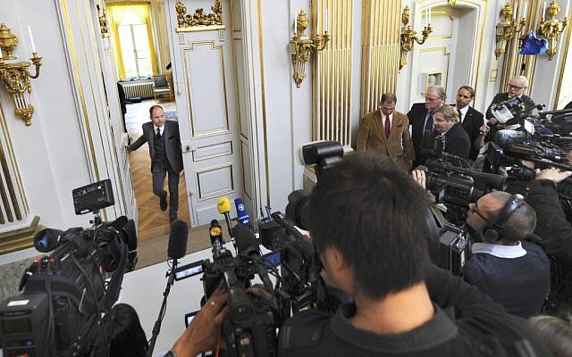 Peter Englund, permanent secretary of the Royal Swedish Academy, arrives to announce that Chinese writer Mo Yan has been named the winner of the 2012 Nobel Prize in literature on October 11 in Stockholm. (photo credit: AP/Fredrik Sandberg)