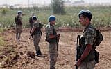 Turkish commandos stand near the Turkish-Syrian border in Akcakale, Turkey, October 2012 (photo credit: AP)