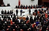 Turkish lawmakers and ministers  at Turkey's parliament in Ankara (photo credit: AP)