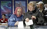 Ukrainians cast their ballots at a polling station in Kiev on Sunday (photo credit: AP/Efrem Lukatsky)
