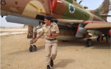 Ron Bronstein shuffling in front of an IAF Skyhawk aircraft. (photo credit: image capture from Ron Bronstein's YouTube video)