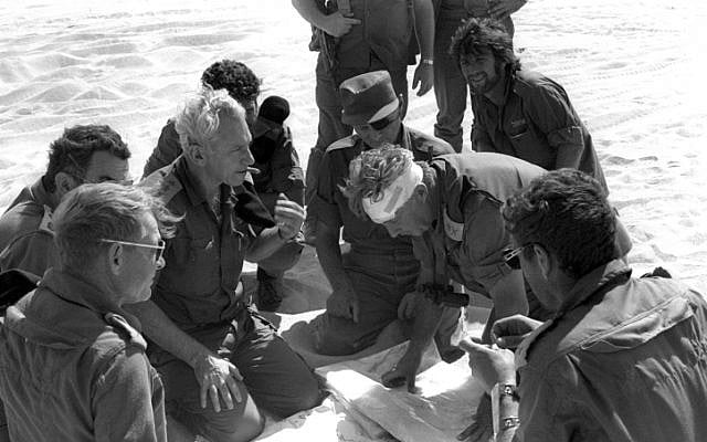 Divisional commander Ariel Sharon consulting with Lt. Gen. Chaim Bar-Lev and other officers on the southern front (Photo credit: GPO/ Flash 90) Divisional commander Ariel Sharon consulting with Lt. Gen. Chaim Bar-Lev and other officers on the southern front (Photo credit: GPO/ Flash 90)