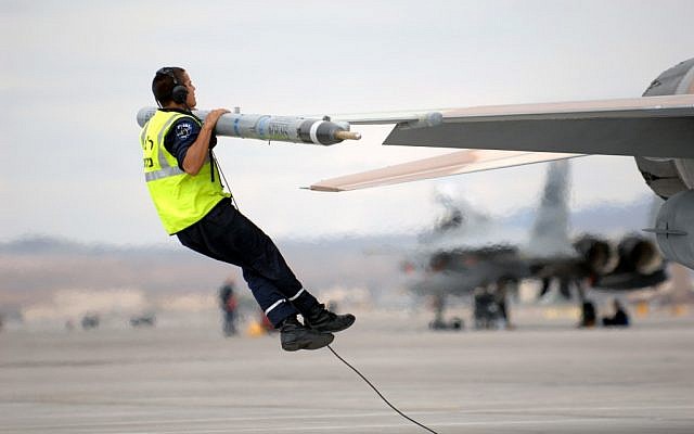 A crew chief from Ramon Air Base jumps up to check the top surfaces of an F-16C Fighting Falcon during a joint US-Israel exercise in 2009. (photo credit: Brett Clashman, U.S. Air Force/ Department of Defense) A crew chief from Ramon Air Base jumps up to check the top surfaces of an F-16C Fighting Falcon during a joint US-Israel exercise in 2009. (photo credit: Brett Clashman, U.S. Air Force/ Department of Defense)