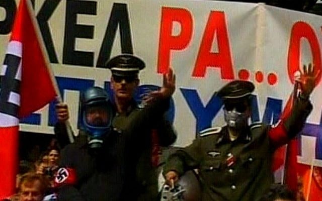 Protesters in Athens dress up as Nazi officers to greet German Chancellor Angela Merkel. (photo credit: image capture from Channel 2)