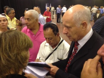 Minister Michael Eitan signing up Likud members opposing the joint list with Yisrael Beytenu, Tel Aviv, October 20, 2012. (photo credit: Raphael Ahren/Times of Israel)