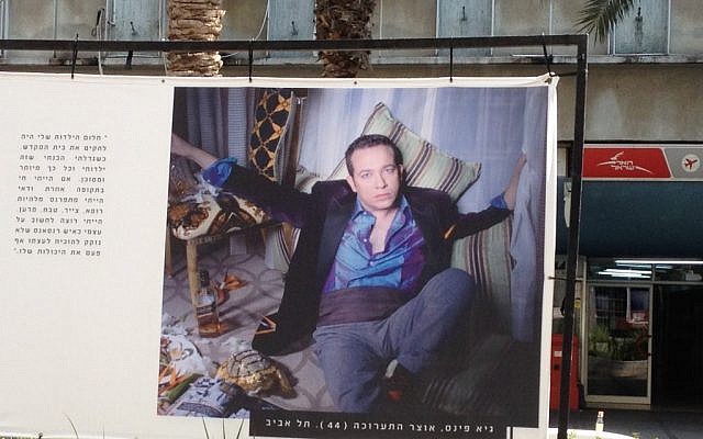 Analyzing curator Guy Pines in Photoanalysis (photo credit: Jessica Steinberg/Times of Israel)
