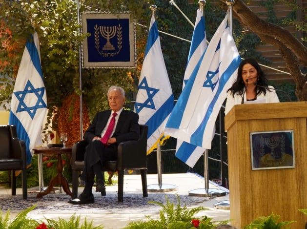 President Shimon Peres shortly before a sign fell on him in his sukkah Wednesday (photo credit: Sharon Marks Altshul) President Shimon Peres shortly before a sign fell on him in his sukkah Wednesday (photo credit: Sharon Marks Altshul)