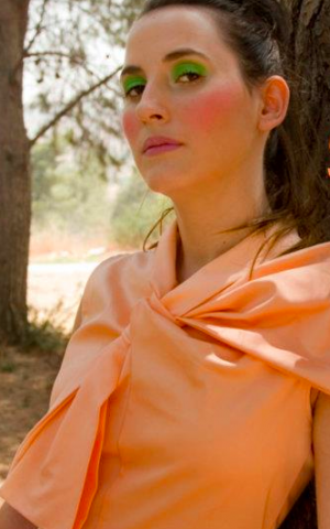 An ascot-like bow on an autumnal shaded dress (Courtesy Shalosh Facebook)