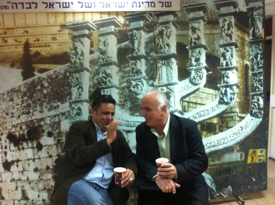 Aatef Karinaoui (left) in front on a Menorah. He says Israel's Jewish symbols shouldn't be a problem for the country's Arab population. (photo credit: courtesy)