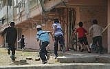Illustrative. Children run toward a bomb shelter in the southern Israeli town of Kiryat Malachi during a November 2012 military operation in Gaza, known as Pillar of Defense. (Yuval Haker/Israel Defense Forces)