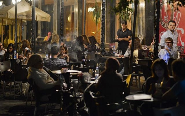 Egyptians relax outside a cafe in Cairo, Egypt, Wednesday, Oct. 31, 2012. Egypt’s capital prides itself on being city that never sleeps, with crowds filling cafes and shops open into the small hours. So the government is facing a backlash from businesses and the public as it vows to impose new nationwide rules closing stores and restaurants early. Officials say the crisis-ridden nation has to conserve electricity, but they also seem intent on taming a population they see as too unruly. (AP Photo) Egyptians relax outside a cafe in Cairo, Egypt, Wednesday, Oct. 31, 2012. Egypt’s capital prides itself on being city that never sleeps, with crowds filling cafes and shops open into the small hours. So the government is facing a backlash from businesses and the public as it vows to impose new nationwide rules closing stores and restaurants early. Officials say the crisis-ridden nation has to conserve electricity, but they also seem intent on taming a population they see as too unruly. (AP Photo)
