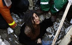 A member of the Abdel Aal family is rescued after his family house collapsed during an Israeli forces strike in the Tufah neighbourhood, Gaza City, Sunday, Nov. 18. (AP Photo/Majed Hamdan)