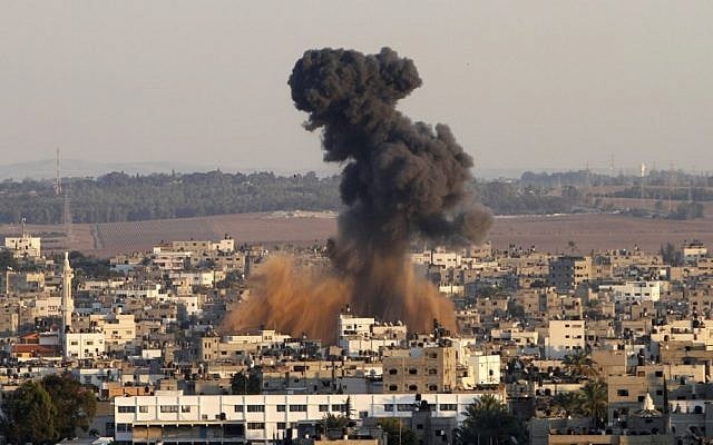Smoke rises following an Israeli strike on Gaza City in 2012 (photo credit: AP/Hatem Moussa)