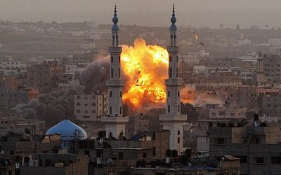Smoke rises during an explosion from an Israeli Air Force strike in Gaza City, Saturday, Nov. 17, 2012 (photo credit: AP/Hatem Moussa)