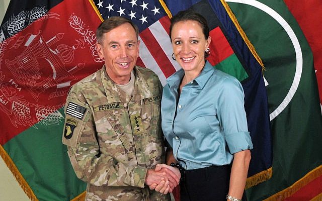 This July 13, 2011, photo made available on the International Security Assistance Force's Flickr website shows the former Commander of International Security Assistance Force and US Forces-Afghanistan Gen. Davis Petraeus, left, shaking hands with Paula Broadwell, co-author of "All In: The Education of General David Petraeus." (AP Photo/ISAF) This July 13, 2011, photo made available on the International Security Assistance Force's Flickr website shows the former Commander of International Security Assistance Force and US Forces-Afghanistan Gen. Davis Petraeus, left, shaking hands with Paula Broadwell, co-author of "All In: The Education of General David Petraeus." (AP Photo/ISAF)