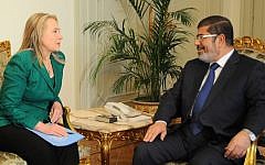 Then US Secretary of State Hillary Rodham Clinton meets with former Egyptian president Mohammed Morsi in Cairo, Egypt, Wednesday, November 21, 2012 (AP/Egyptian Presidency)