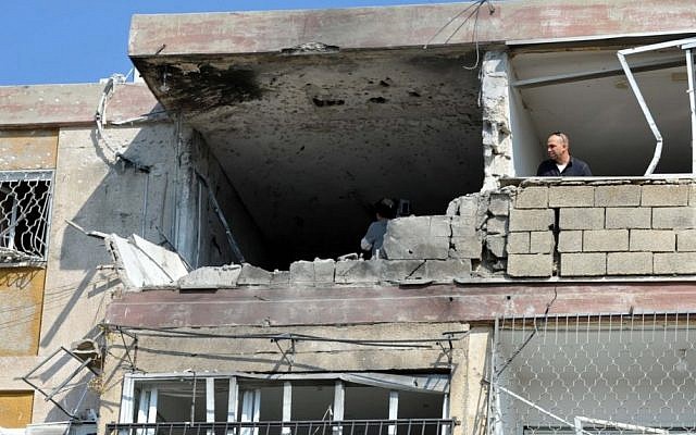 The four-story building that was struck Thursday, killing three Israelis, in Kiryat Malachi (photo credit: David Katz/The Israel Project)