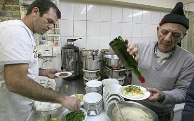 Mr. Shreffler and son serving it up at Azura (photo credit: Nati Shohat/Flash 90) Mr. Shreffler and son serving it up at Azura (photo credit: Nati Shohat/Flash 90)