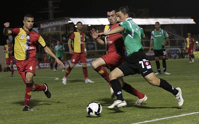 F.C.A Ashdod play against Maccabi Haifa in an Israeli league soccer match in Ashdod (illustrative photo credit: Tsafrir Abayov/Flash90) F.C.A Ashdod play against Maccabi Haifa in an Israeli league soccer match in Ashdod (illustrative photo credit: Tsafrir Abayov/Flash90)