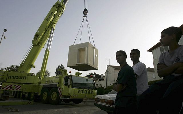 Workers place new bomb shelters in schools and day care centers in the southern Israeli town of Ashkelon. April, 2009. 20 more shelters were due to be installed on Sunday 18th November after increased Hamas rocket fire at the city. (photo credit: Edi Israel/Flash90)
