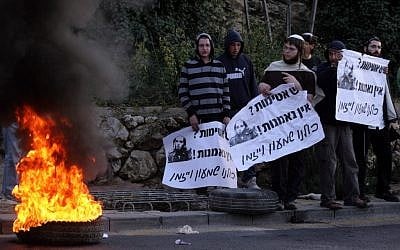 Illustrative: Youth aligned with the settler movement burning tires in Jerusalem in 2012 to protest an outpost demolition. (Abir Sultan/ Flash90) Illustrative: Youth aligned with the settler movement burning tires in Jerusalem in 2012 to protest an outpost demolition. (Abir Sultan/ Flash90)