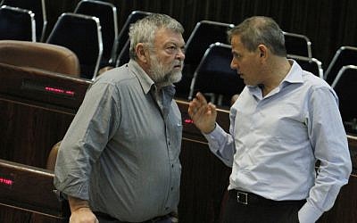 Meretz MK Ilan Gilon, left, speaks with fellow party member Nitzan Horowitz in the Knesset last November (photo credit: Miriam Alster/Flash90)