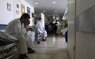 Patients wait in the hallway of the Barzilai Medical Center (photo credit: Tsafrir Abayov/Flash90) Patients wait in the hallway of the Barzilai Medical Center (photo credit: Tsafrir Abayov/Flash90)