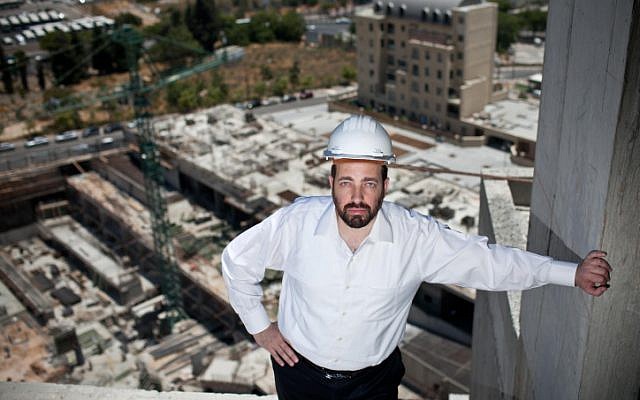 Housing and Construction Minister Ariel Atias, of the ultra-orthodox Shas party, looks over a construction site on June 22, 2012. (photo credit: Noam Moskowitz/Flash90)