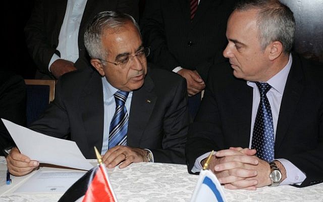 THen Finance Minister Yuval Steinitz (right) meets with PA Prime Minister Salam Fayyad as they sign an economic agreement in Jerusalem on July 31, 2012 (Moshe Milner/GPO/Flash90) THen Finance Minister Yuval Steinitz (right) meets with PA Prime Minister Salam Fayyad as they sign an economic agreement in Jerusalem on July 31, 2012 (Moshe Milner/GPO/Flash90)