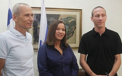 Chairwoman Shelly Yachimovich, center, introduces former Sayeret Matkal commander Omer Bar-Lev, left, and educator Chili Tropper as new recruits to the Labor Party in October (photo credit: Roni Schutzer/Flash90)