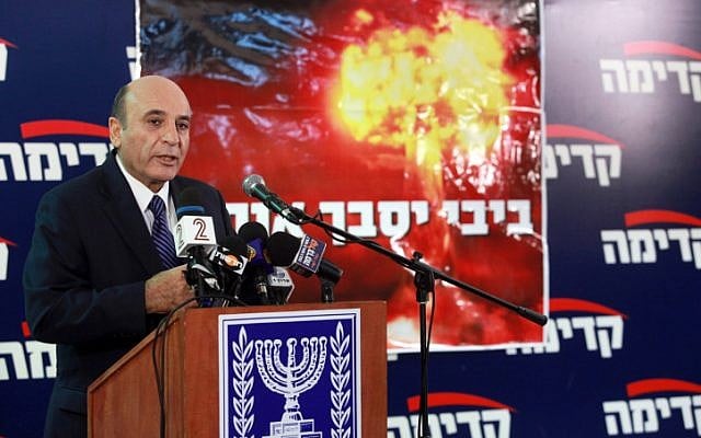 Kadima head Shaul Mofaz presents the party's election campaign slogan, 'Bibi will get us in trouble,' in November (photo credit: Flash90)