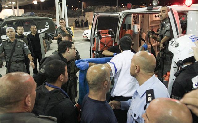 Border policemen were injured during riots in Shuafat, Tuesday (photo credit: Oren Nahshon/Flash90)