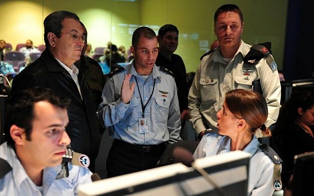 Defense Minister Ehud Barak (left in black) supervises the launching of a Patriot missile during air defense exercises on November 12, 2012 (photo credit: Defense Ministry/Flash90)