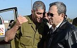 GOC Southern Command Maj. Gen. Tal Russo (left) and Defense Minister Ehud Barak (right) talk on a base near the border of the Gaza Strip on Wednesday. (photo credit: Ben Avraham/Defense Ministry/Flash90)