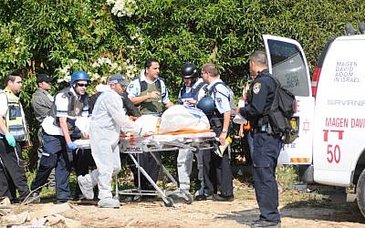 One of the victims of a rocket strike on an apartment building in Kiryat Milachi is taken away in an ambulance. Three people were killed Thursday morning November 15 2012, when a Grad rocket hit the building. (photo credit: Yossi Zeliger/Flash90) One of the victims of a rocket strike on an apartment building in Kiryat Milachi is taken away in an ambulance. Three people were killed Thursday morning November 15 2012, when a Grad rocket hit the building. (photo credit: Yossi Zeliger/Flash90)