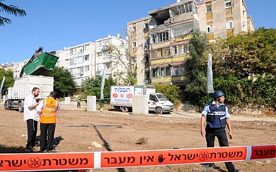 Three people were killed Thursday morning November 15 2012, when a Grad rocket hit an apartment building in Kiryat Malachi. (photo credit: Yossi Zeliger/Flash90) Three people were killed Thursday morning November 15 2012, when a Grad rocket hit an apartment building in Kiryat Malachi. (photo credit: Yossi Zeliger/Flash90)